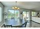 Dining room with chandelier, hardwood floors and large window with a view at 2168 E Vista Bonita Dr, Phoenix, AZ 85024