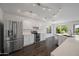 Spacious kitchen with hardwood floors, stainless steel appliances, and a large island at 2168 E Vista Bonita Dr, Phoenix, AZ 85024