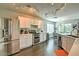 Bright eat-in kitchen featuring stainless steel appliances, white cabinets, and track lighting at 2168 E Vista Bonita Dr, Phoenix, AZ 85024