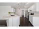 Modern kitchen with hardwood floors, white cabinetry, and stainless steel appliances at 2168 E Vista Bonita Dr, Phoenix, AZ 85024