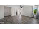 Light-filled bedroom, with wood-look tile flooring, and access to a private balcony at 2168 E Vista Bonita Dr, Phoenix, AZ 85024