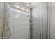 Close up of the stunning tile shower with adjustable shower head and built-in shelving at 2168 E Vista Bonita Dr, Phoenix, AZ 85024