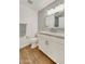 Bathroom with wood floors, white vanity and gray countertop at 21915 N 65Th Ave, Glendale, AZ 85310