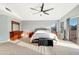 Bright main bedroom featuring a ceiling fan, outdoor access and cozy decor at 21915 N 65Th Ave, Glendale, AZ 85310