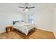 Bedroom with a ceiling fan, wood floors and a comfortable bed at 21915 N 65Th Ave, Glendale, AZ 85310