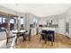 Open-concept kitchen with stainless steel appliances, island seating, and an adjacent dining area at 21915 N 65Th Ave, Glendale, AZ 85310