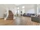 Spacious living room boasts high ceilings, lots of natural light and wood plank flooring at 21915 N 65Th Ave, Glendale, AZ 85310