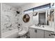 Stylish bathroom featuring marble tile, sleek black fixtures, and modern decor at 24021 N 39Th Ln, Glendale, AZ 85310