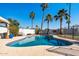 Beautiful pool surrounded by mature palm trees creating a tranquil and private outdoor oasis at 24021 N 39Th Ln, Glendale, AZ 85310