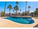 Refreshing pool with a play structure in a grassy area, perfect for Gathering fun and outdoor enjoyment at 24021 N 39Th Ln, Glendale, AZ 85310