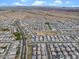 Aerial view of a desert community nestled against mountains; home is outlined in red at 25268 N 142Nd Dr, Surprise, AZ 85387