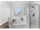 Bright bathroom showcasing a bathtub and standing shower at 25268 N 142Nd Dr, Surprise, AZ 85387