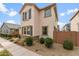 A two-story home with neutral stucco, stone accents, and a low-maintenance yard at 25268 N 142Nd Dr, Surprise, AZ 85387