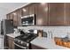 Close up of kitchen with quartz countertops and stainless steel appliances at 25268 N 142Nd Dr, Surprise, AZ 85387