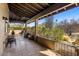 Inviting outdoor patio with tile flooring, ceiling fan, pillars, and desert landscaping view at 25621 N Cordova Ln, Rio Verde, AZ 85263