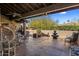 Relaxing outdoor area featuring a fountain, seating arrangements, and lush desert landscaping at 25621 N Cordova Ln, Rio Verde, AZ 85263