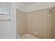 Bathroom featuring neutral tile and shower-tub combo at 2706 W Estrella Dr, Chandler, AZ 85224