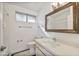 Clean bathroom with modern mirror, white countertops, and tiled floor at 2706 W Estrella Dr, Chandler, AZ 85224