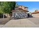 Two-story home with a well-maintained yard and a two-car garage at 2706 W Estrella Dr, Chandler, AZ 85224