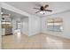 Bright living room with tiled floor, ceiling fan, and ample natural light at 2706 W Estrella Dr, Chandler, AZ 85224