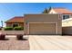 Inviting home featuring a two car garage, a tile roof, and low maintenance desert landscaping at 2848 E Brown Rd # 30, Mesa, AZ 85213