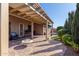 Outdoor patio area with brick pavers, built-in grill, and a charming pergola-covered seating area at 2854 S Berrywood --, Mesa, AZ 85212