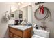 Bathroom features a wood vanity, framed mirrors and neutral wall paint at 2854 S Berrywood --, Mesa, AZ 85212