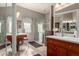 Accessible bathroom featuring wooden vanity, updated shower, thoughtful fixtures, and an accessible design at 2854 S Berrywood --, Mesa, AZ 85212