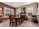 Dining room features wood floors, neutral paint, a wood table and shuttered windows at 2854 S Berrywood --, Mesa, AZ 85212