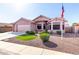 Single-story home with desert landscaping and an American flag out front at 2854 S Berrywood --, Mesa, AZ 85212