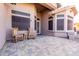 Covered porch with rocking chairs and multicolored brick at 2854 S Berrywood --, Mesa, AZ 85212