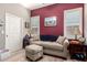 Cozy living room with a sofa, wood floors, natural light, and warm color tones at 2854 S Berrywood --, Mesa, AZ 85212