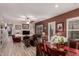 Dining area flows into comfortable living room with hardwood floors and a ceiling fan at 2854 S Berrywood --, Mesa, AZ 85212