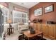 Cozy living room featuring a neutral palette, a comfortable recliner, natural light, and hardwood flooring at 2854 S Berrywood --, Mesa, AZ 85212