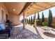 Relaxing covered patio featuring a pergola, brick pavers, built-in BBQ and an outdoor fire pit at 2854 S Berrywood --, Mesa, AZ 85212