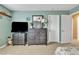 Bedroom with neutral carpet, full dresser, decorative mirror, and entry to walk-in closet at 29740 W Fairmount Ave, Buckeye, AZ 85396