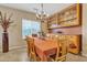 Formal dining room featuring a chandelier, built-in cabinetry, and seating for six at 29740 W Fairmount Ave, Buckeye, AZ 85396