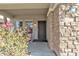 Charming front entry with stone accents, a covered porch, and well maintained plants at 29740 W Fairmount Ave, Buckeye, AZ 85396