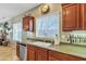 Bright and modern kitchen with stainless steel appliances, granite counters, and natural lighting at 29740 W Fairmount Ave, Buckeye, AZ 85396