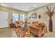 Inviting living room with neutral tones, comfortable seating, and a decorative rug at 29740 W Fairmount Ave, Buckeye, AZ 85396