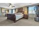 Serene main bedroom with a plush king bed, elegant decor, and plenty of natural light at 29740 W Fairmount Ave, Buckeye, AZ 85396