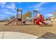 A colorful playground promises hours of fun for , complete with slides and climbing structures at 29740 W Fairmount Ave, Buckeye, AZ 85396