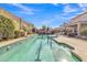 Swimming pool with a basketball hoop and beautiful landscaping at 29740 W Fairmount Ave, Buckeye, AZ 85396