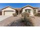 Charming single-story home with desert landscaping and a two-car garage, showcasing its inviting curb appeal at 3034 E Coconino Dr, Gilbert, AZ 85298