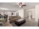 Inviting living room with a ceiling fan, seamlessly connecting to the kitchen and dining area for a spacious feel at 3034 E Coconino Dr, Gilbert, AZ 85298