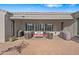Covered patio with comfortable seating and shade covers at 30488 N 126Th Dr, Peoria, AZ 85383