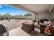 Backyard featuring a covered patio, outdoor furniture, brick pavers and basketball court at 30488 N 126Th Dr, Peoria, AZ 85383