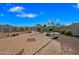 Backyard featuring a pool, a basketball court, lounge chairs and well-maintained landscaping at 30488 N 126Th Dr, Peoria, AZ 85383