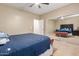 Bright bedroom showcasing a large mirrored closet and comfortable queen size bed at 30488 N 126Th Dr, Peoria, AZ 85383