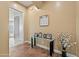 Bright entryway showcases a glass table with decorative accents and a neutral color scheme at 30488 N 126Th Dr, Peoria, AZ 85383